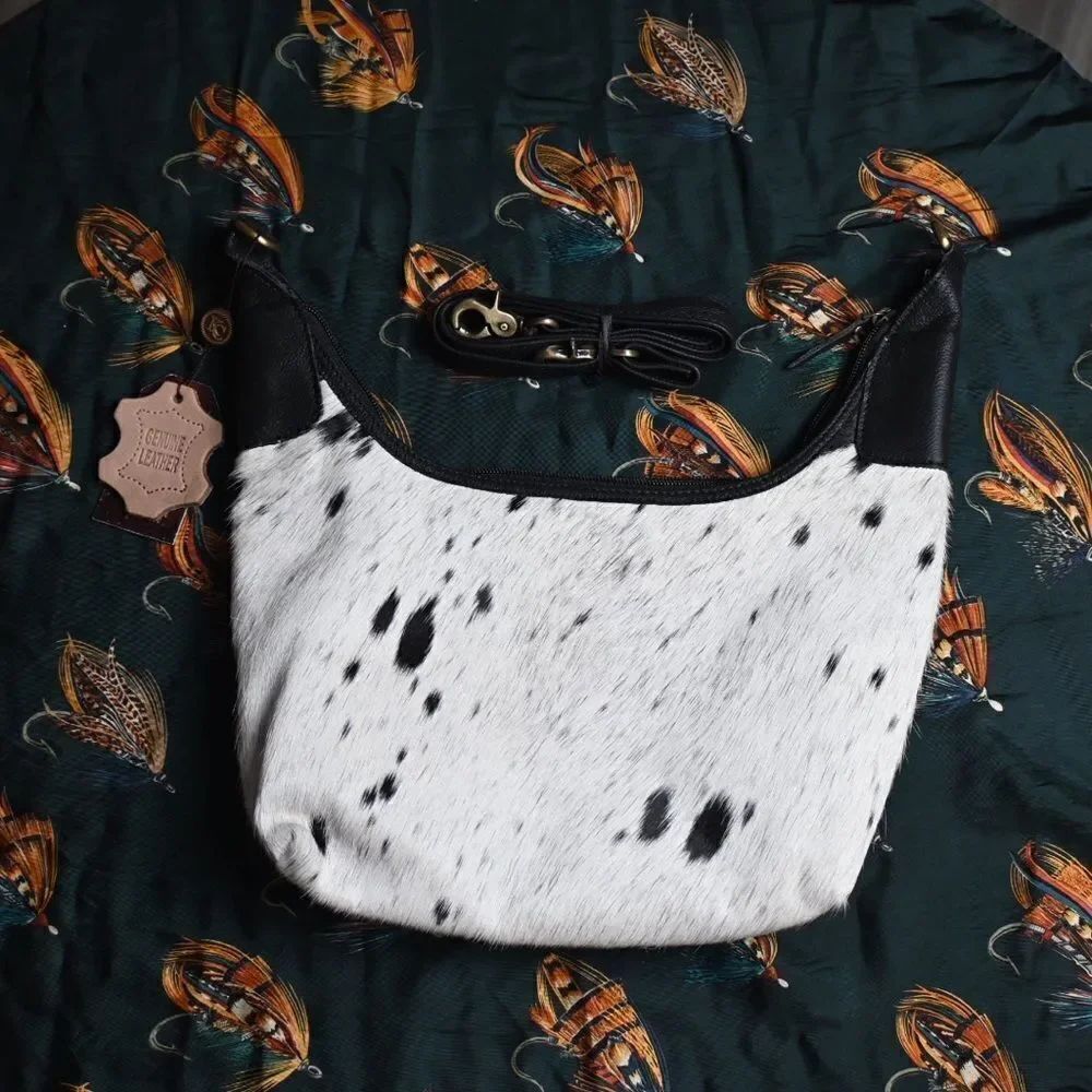 Klassy Cowgirl Hair onโCowhide HoboโBag